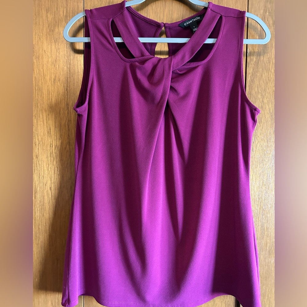 Bright sleeveless blouse with cutout details and keyhole back